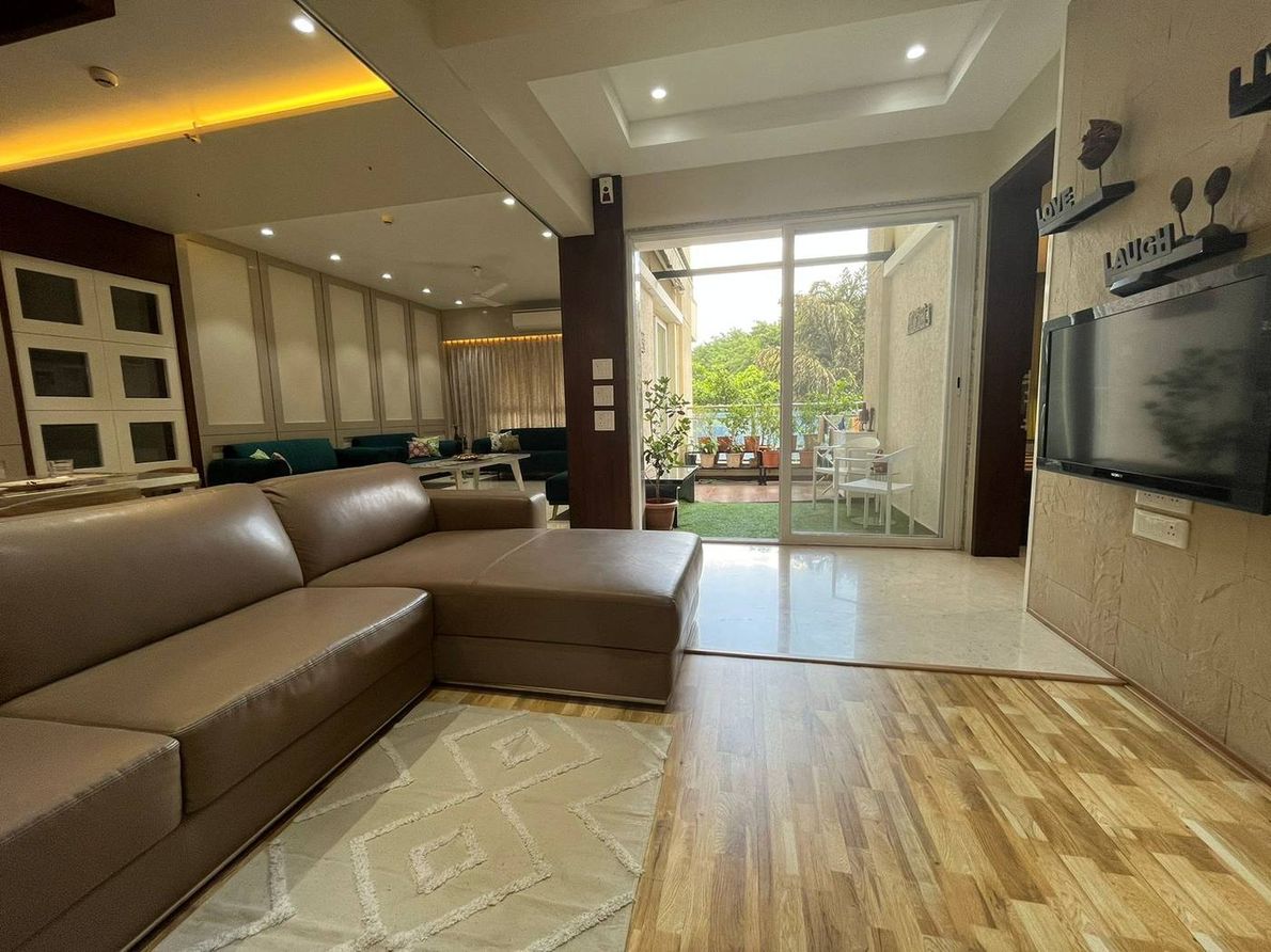 The Kogta House - leather sectional sofa opening onto the balcony