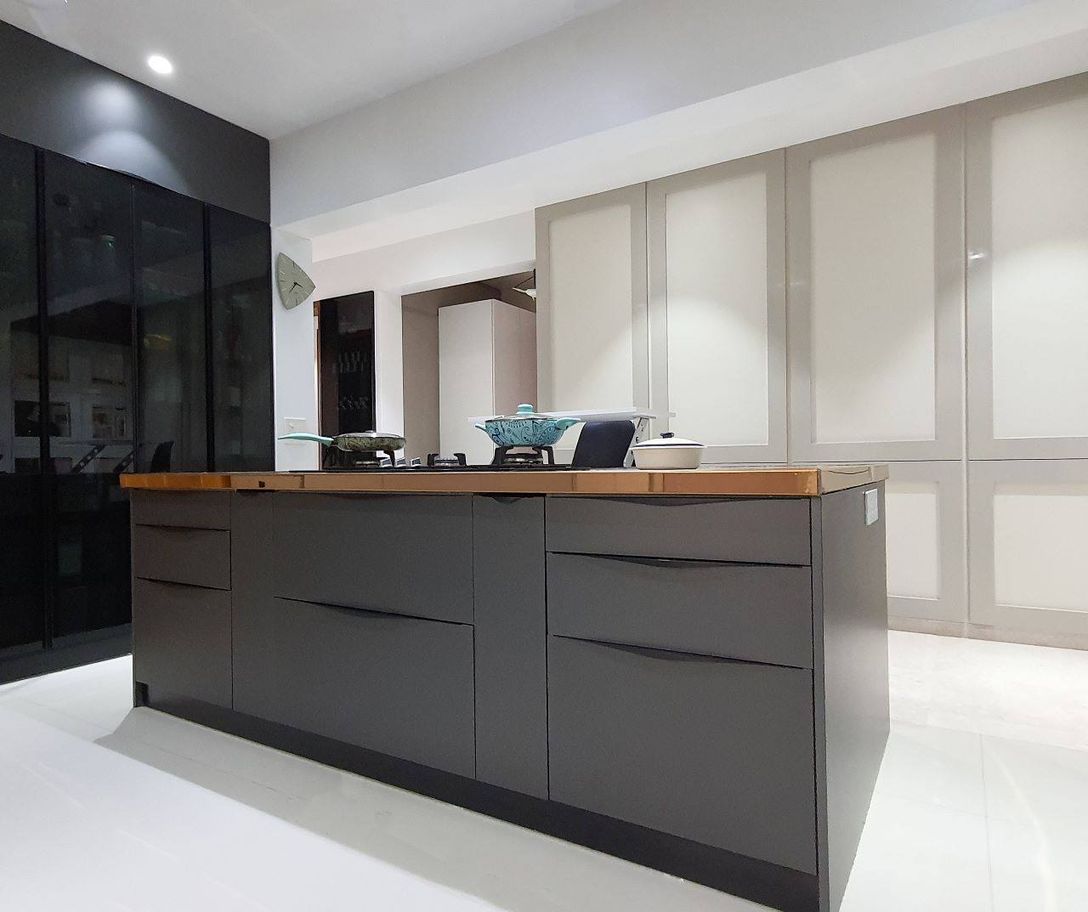 The Kogta House - kitchen island with marble and copper-trimmed counter