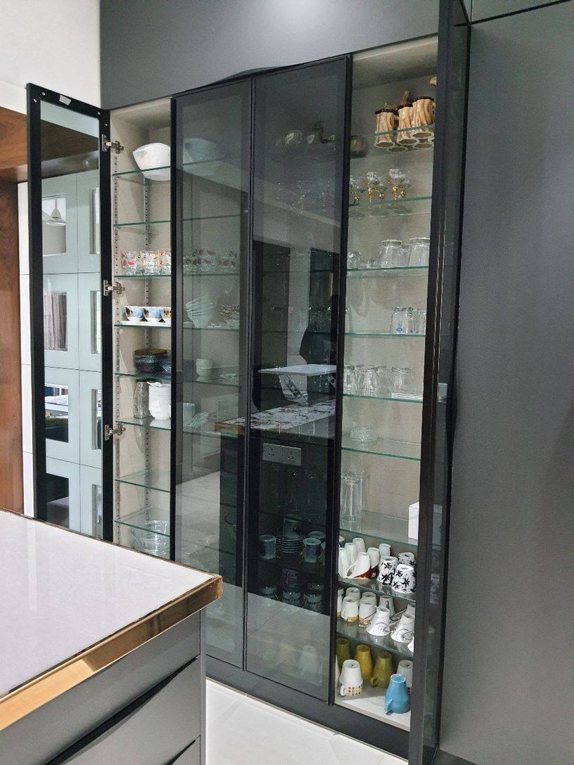 The Kogta House - glass-fronted crockery display unit