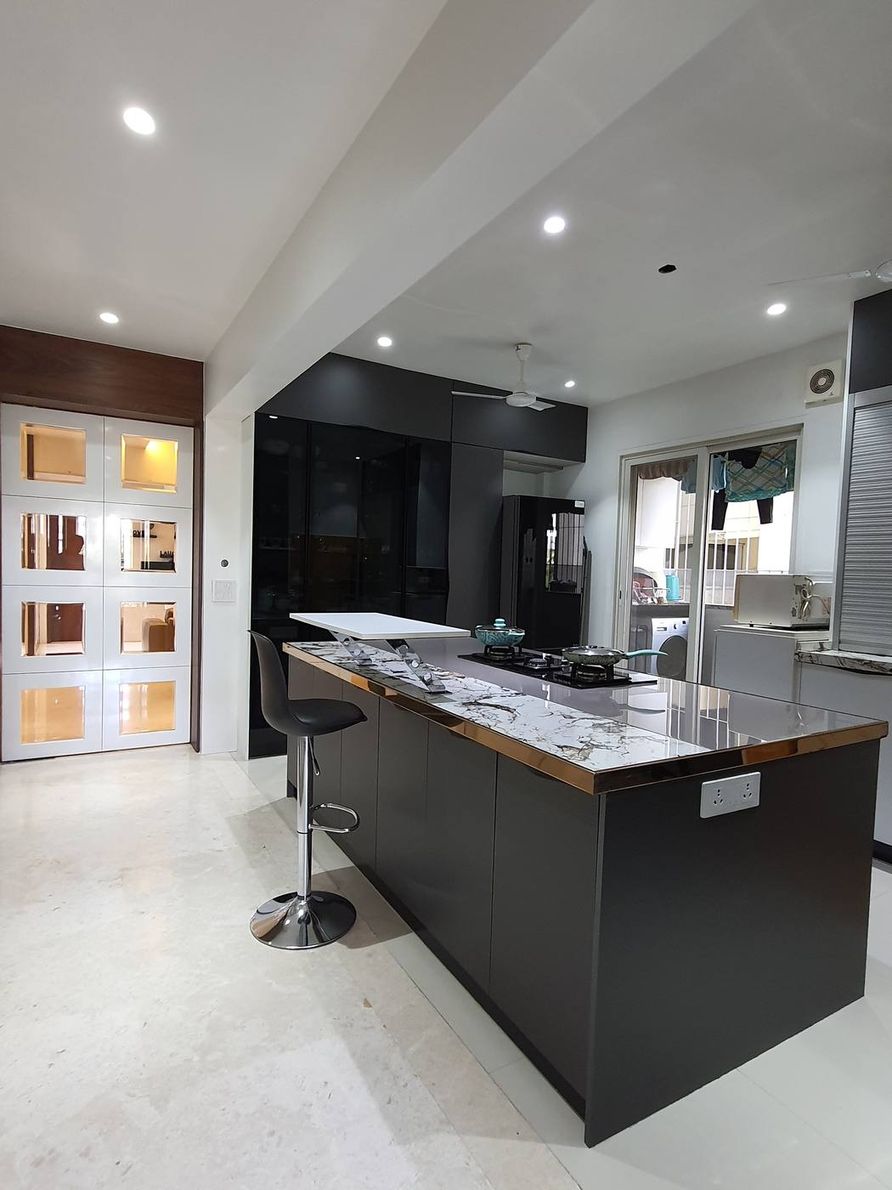 The Kogta House - dark kitchen bar counter with marble inlay