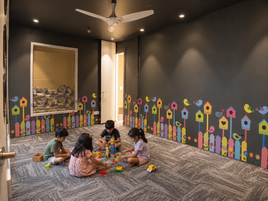 Ruby House children's playroom with birdhouse mural